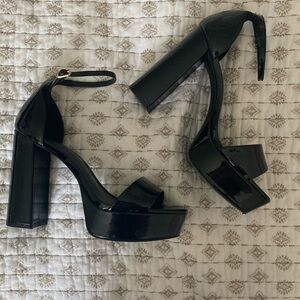 Black platform heels.Worn once, some scratches as shown.Size 8, fits like 7 1/2.
